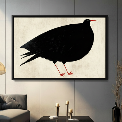 Minimalist black bird with red beak and legs framed canvas wall art displayed in modern living room above coffee table with candles