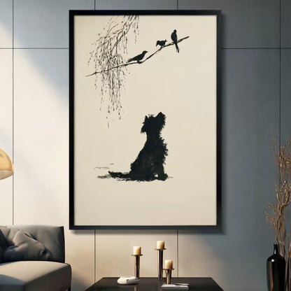 Minimalist ink-style terrier dog silhouette gazing at three birds on willow branch black framed canvas art on a dark gray paneled wall above a gray sofa with pillar candle holders and a black decorative vase