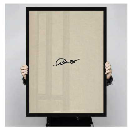 Minimalist dog and coffee cup single-stroke line art in a wide deep black frame held up against a light gray backdrop, whimsical pet wall art print on a warm cream background