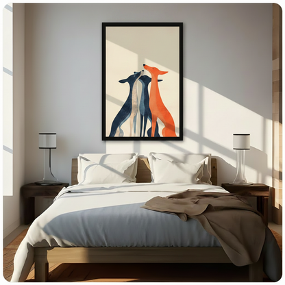 Framed canvas print of three stylized greyhounds in navy blue and vibrant orange, minimalist dog wall art hung above a bed as a statement piece in a sunlit modern bedroom