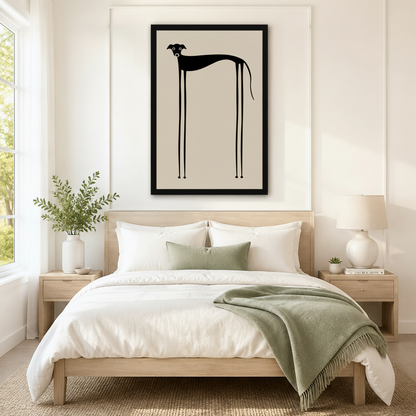 Elegant framed minimalist wall art of a quirky black greyhound with a long arched body and stick-thin legs on a warm sand background, displayed above a white and sage linen bed in a serene Scandinavian bedroom