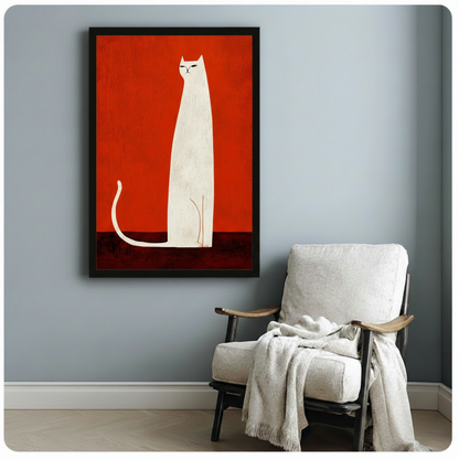 Bold white cat on red background canvas art in black frame, hung on blue-grey wall beside white linen armchair in Scandinavian-style room