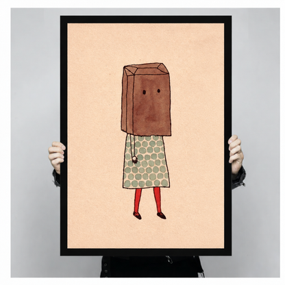 Handheld framed print of a paper bag girl in a polka-dot dress against peach.