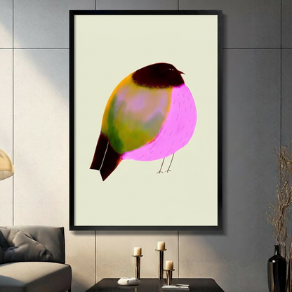 Plump illustrated bird with neon pink breast and olive-green wings on cream background, black framed canvas wall art displayed above a dark console with pillar candles and black vase against a gray paneled wall