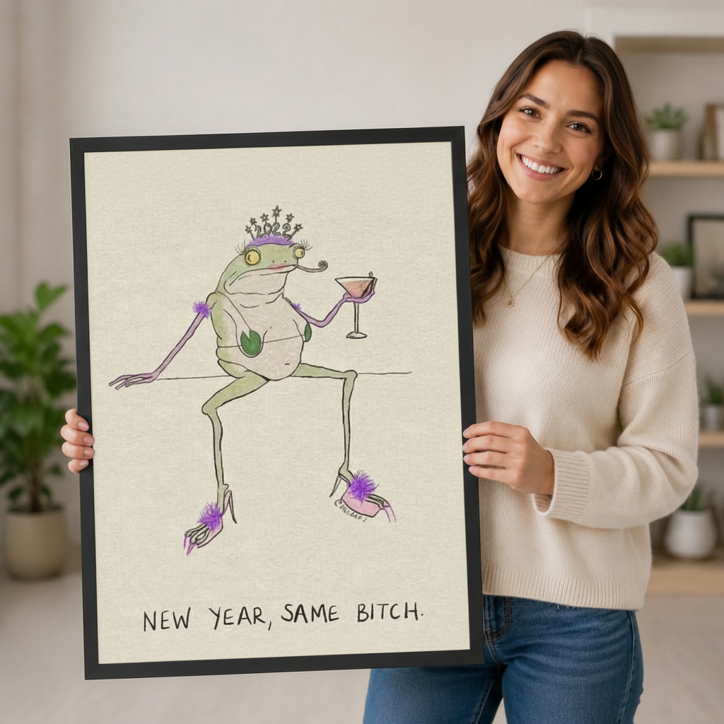Woman smiling holding large new year same bitch frog wall art framed print showing crowned frog in purple heels with cocktail