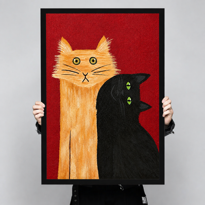 Bold folk art painting of a tall orange tabby cat with wide eyes beside a black cat with green eyes on a red background funny cat wall art framed print held up