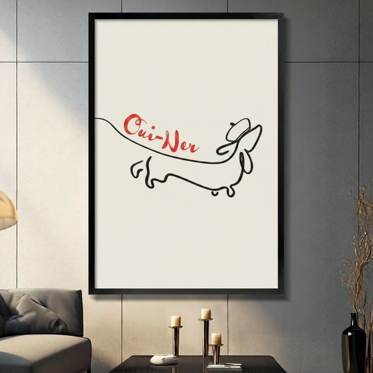 Minimalist dachshund line art with red Oui-Ner script, framed canvas print in black frame hung on grey tile wall in modern living room