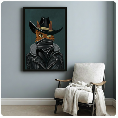 Graphic cat portrait of a fierce orange cat with green eyes in a black cowboy hat black mask and leather biker jacket against a deep teal background cool outlaw cat wall art framed print beside a white linen armchair on a blue gray wall