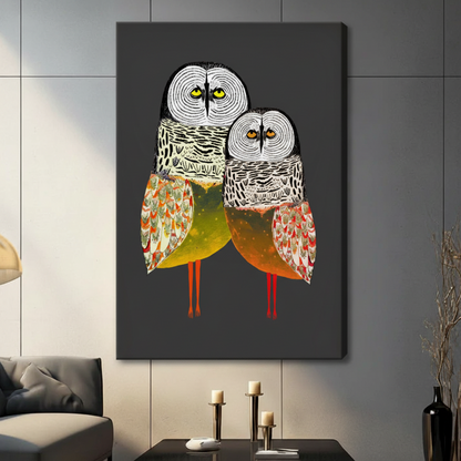 Owl duo folk art stretched canvas displayed in modern living room — bold bird illustration with golden-green and burnt orange wings, eclectic wall decor