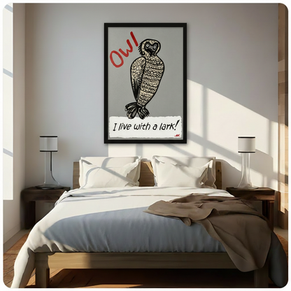Black framed charming whimsical owl humor canvas wall art featuring a round startled owl in bold linocut illustration style with red handwritten OW above and I live with a lark in black script on a torn white paper banner below red MK artist signature funny bird typography print on gray background hung in bright diagonal sunlight above a dark wood bed with white linen bedding and matching bedside lamps