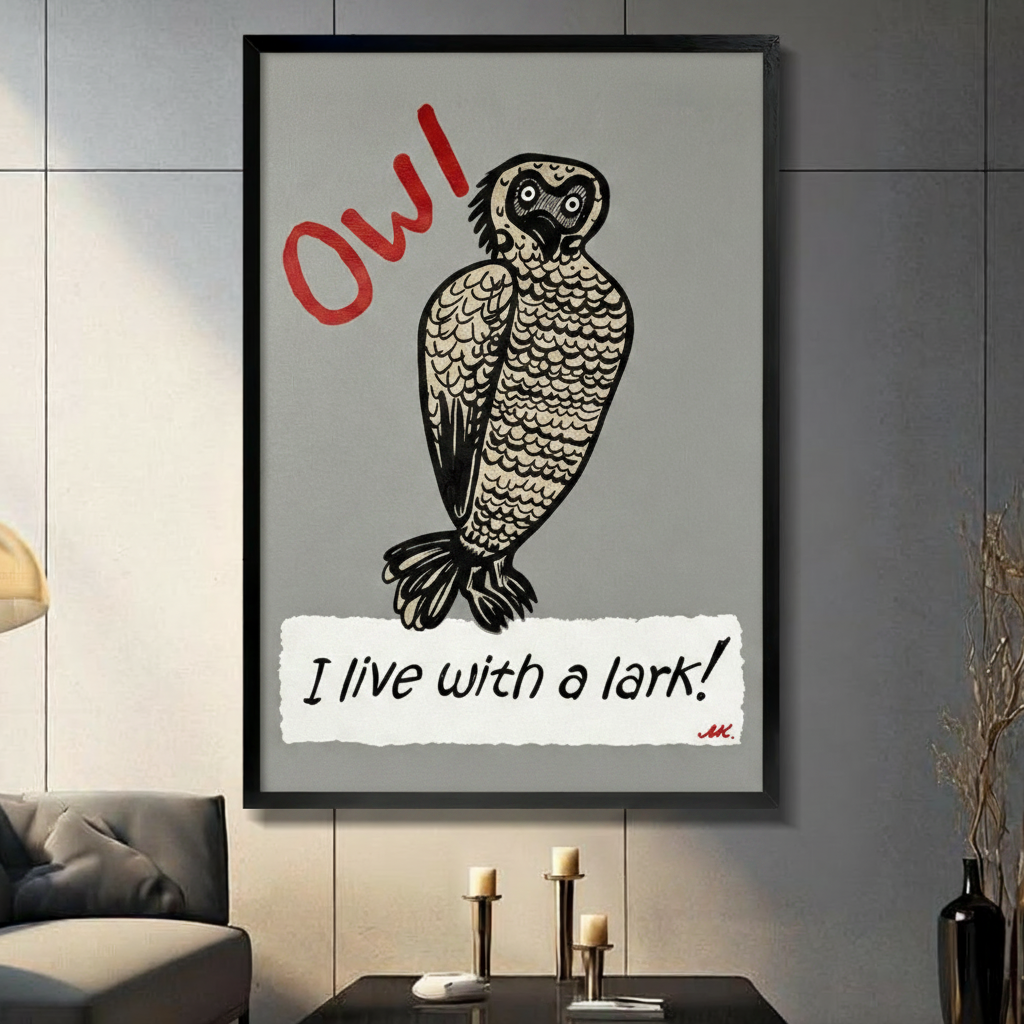 Black framed whimsical linocut style illustration of a wide-eyed round owl with detailed feather texture and the bold red handwritten text OW in the upper left and the phrase I live with a lark in black script on a torn white paper strip at the bottom funny owl humor typography canvas wall art on medium gray background displayed in a modern gray living room with dark sofa and candlesticks