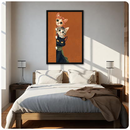 Three cats peeking around a corner orange with bow tabby and black with green scarf funny cat wall art framed print above bed sunlit bedroom