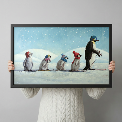 Person in white cable-knit sweater holding black-framed whimsical penguin skiing painting — size reference for funny animal wall art print