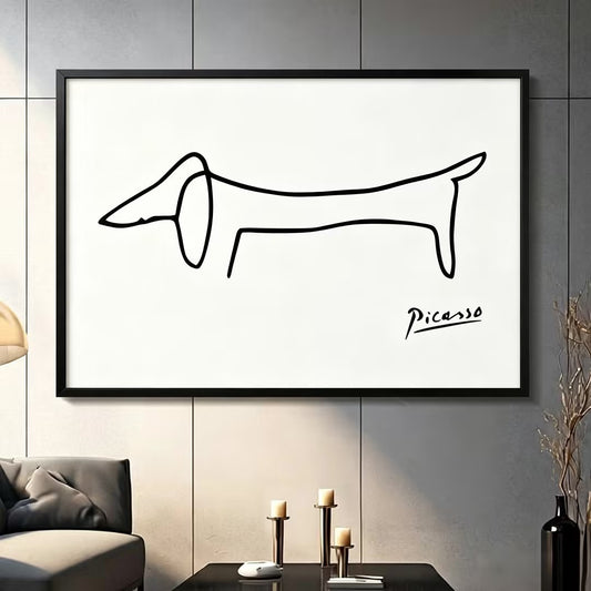 Picasso-inspired dachshund single-stroke sketch black framed canvas art mounted on dark gray paneled wall above charcoal sofa with brass candle holders, minimalist modern home decor