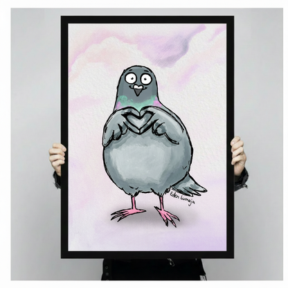 Person holding large framed pigeon wall art print showing size reference, cartoon bird with heart wing gesture