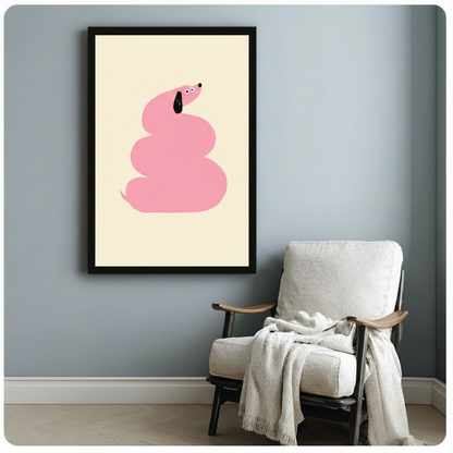 Vertical framed canvas of a playful pink dachshund coiled into a swirl shape with a black ear, hung on a blue-grey wall beside a linen accent chair with a draped throw