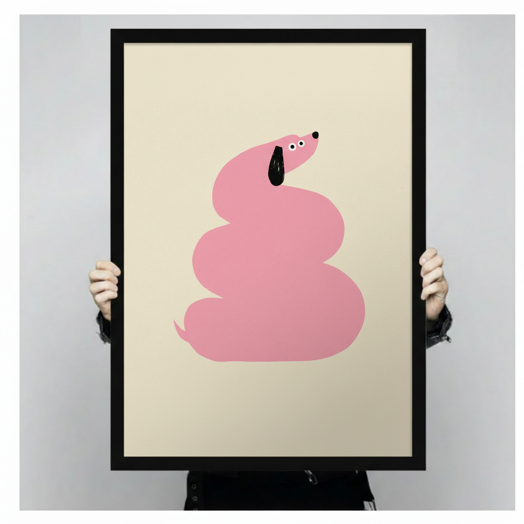 Hand-held framed wall art print showing a bold pink dachshund spiraled into a round coil with a black floppy ear and wide eyes on a cream beige background