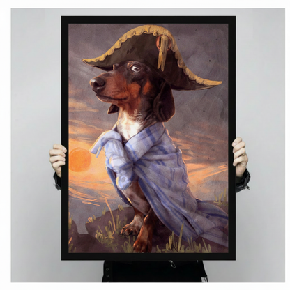 Hands holding a black framed dachshund in pirate costume wall art print, featuring a dramatic golden sunset sky and tricorn hat portrait style