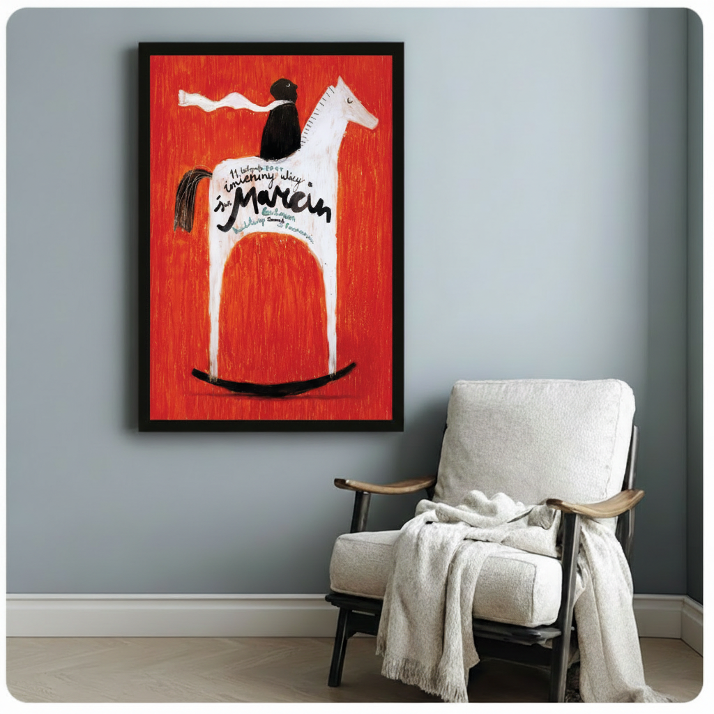 Black framed retro Polish folk art print of cloaked black rider on white rocking horse against striking red background with calligraphy text, styled beside white linen armchair on grey wall