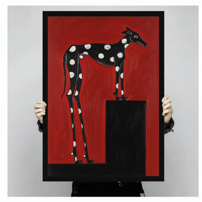 Graphic folk painting of a black polka-dot greyhound on a black pedestal against a flat red background bold dog wall art framed print held against a light gray background