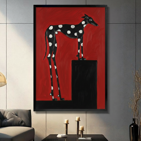 Bold graphic oil painting of a black polka-dot greyhound standing on a black pedestal against a vivid red background graphic dog wall art framed print in a living room with dark gray panel wall dark sofa and black vase