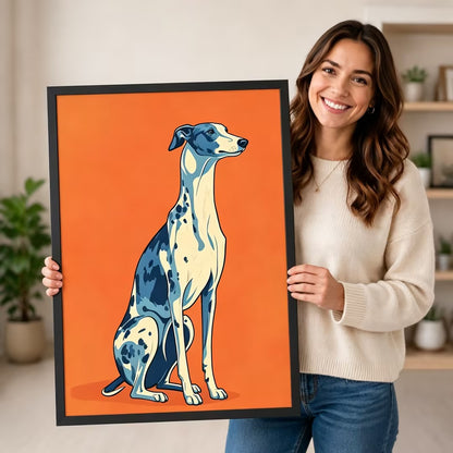 Smiling woman in cream sweater holding a black framed pop art blue and white greyhound portrait canvas art on bold orange background against a neutral indoor background with potted plants and open shelving