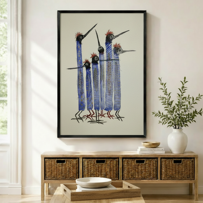 Quirky blue long-necked birds flock framed wall art print hung above wicker storage console in boho entryway