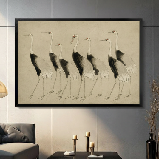 Japanese ink wash painting of six red-crowned cranes in a walking procession with white feathers black wings and long legs in varied graceful poses on an aged parchment background refined crane wall art framed print in a living room with dark gray panel wall dark sofa and black vase