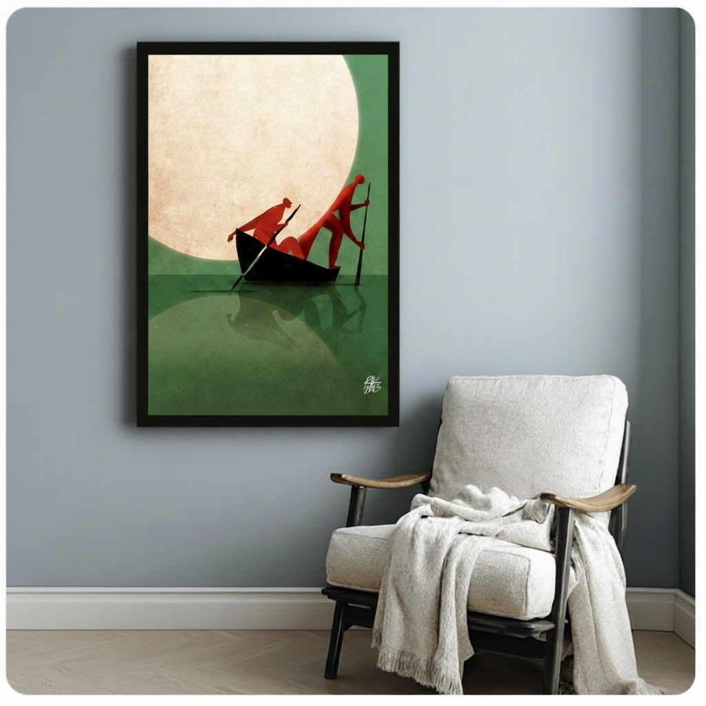 Black-framed abstract figurative wall art of two red figures navigating a boat on green water beneath a luminous full moon, styled on a soft blue-grey wall beside a white linen armchair