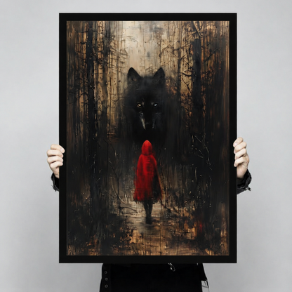 Close-up of dark fantasy art print showing Red Riding Hood and a menacing black wolf in a moody forest, held in hands to show print quality