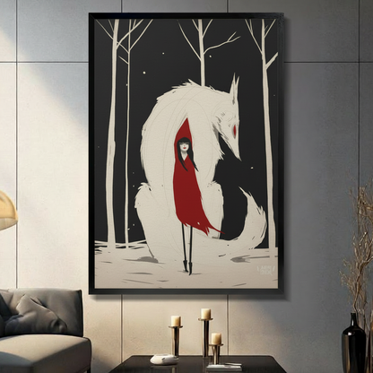 Framed canvas wall art of a red-cloaked girl standing before a giant white wolf in a snowy winter forest, displayed in a dark modern living room