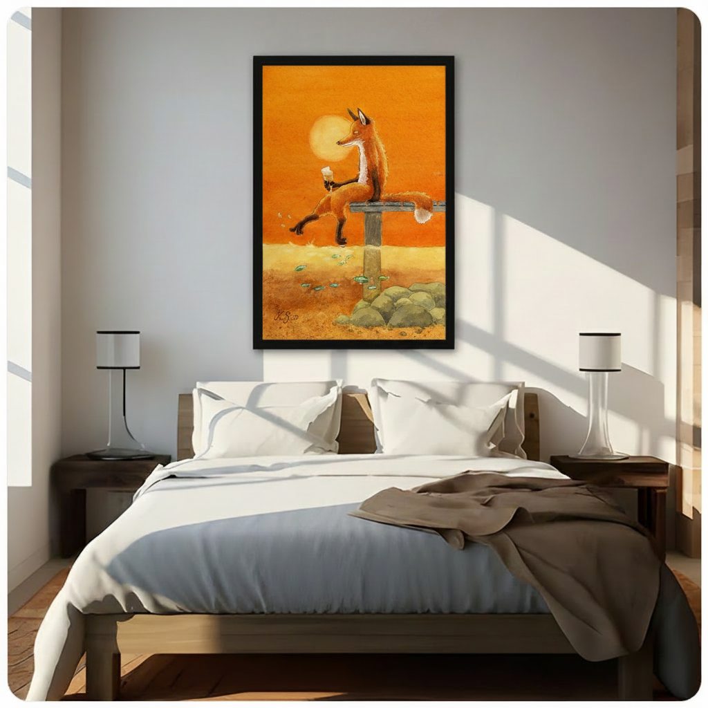 Framed wall art print of a relaxed fox enjoying wine at golden sunset with fish below hung above bed in bright airy bedroom