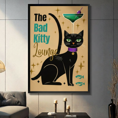 Black framed retro mid-century bad kitty lounge black cat canvas art featuring a sleek green-eyed black cat with a purple collar balancing a green martini cocktail on its head, with teal fish icons and gold starburst accents on a warm sandy background, displayed on a dark gray tile wall above a console table with pillar candlesticks beside a charcoal sofa