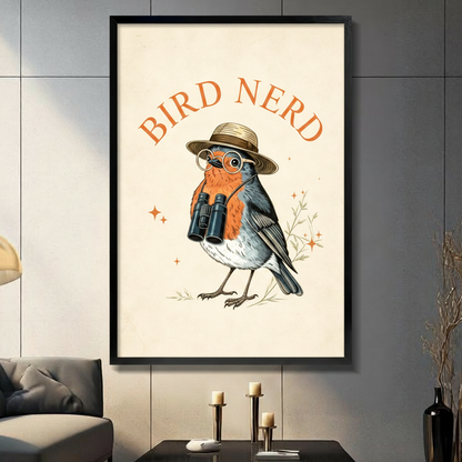 Retro Bird Nerd robin with straw hat, round glasses, and binoculars framed wall art print displayed in a living room with gray sofa, pillar candle holders, and black decorative vase against dark gray tiled wall