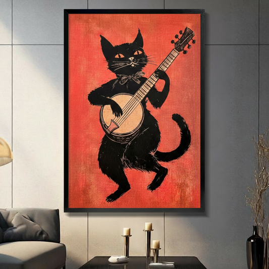 Retro black cat playing banjo framed wall art in black frame on dark gray wall above console table with candles, vintage folk music linocut print for living room decor