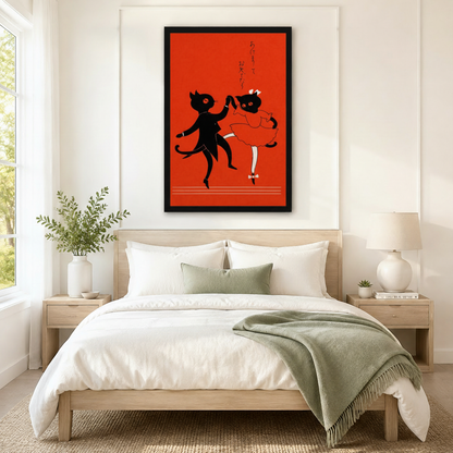 Black framed Japanese retro dancing cat couple wall art above a light wood bed with white linen bedding, a sage green throw blanket, wooden nightstands, and a ceramic table lamp in a bright bedroom