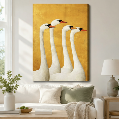 Stretched canvas wall art of a bold retro folk art four white swans group portrait featuring four graceful swans with black crowns and orange beaks arranged in a cascading row in rich impasto oil texture on a bright golden yellow aged background, hung above a white sofa with sage green and cream pillows and a ceramic table lamp in a bright airy living room