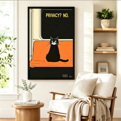Black framed retro vintage poster black and white cat on orange subway seat "Privacy? No." wall art beside a white linen armchair with a taupe throw blanket, a round wood side table, and open shelving with potted plants