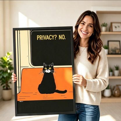 Smiling woman in cream sweater holding a black framed retro subway-style black and white cat "Privacy? No." funny quote art print on bold black and orange background against a neutral indoor background with potted plants and open shelving