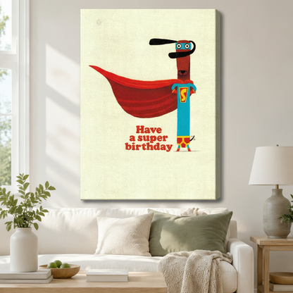 Stretched canvas retro funny superhero dachshund Have a Super Birthday wall art featuring a slim brown dachshund in a teal superhero costume with a flowing red cape and blue mask on a warm vintage cream background, hung above a white sofa with sage green pillows in a bright living room