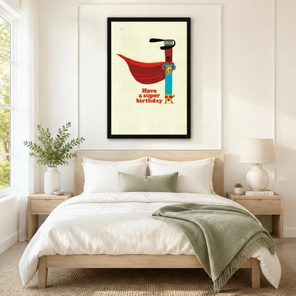 Black framed retro funny superhero dachshund Have a Super Birthday canvas art with a slim brown dachshund in a teal superhero suit and flowing red cape with a blue mask on a vintage cream background, hung above a light wood bed with white linen bedding and a sage green throw in a serene Scandinavian bedroom