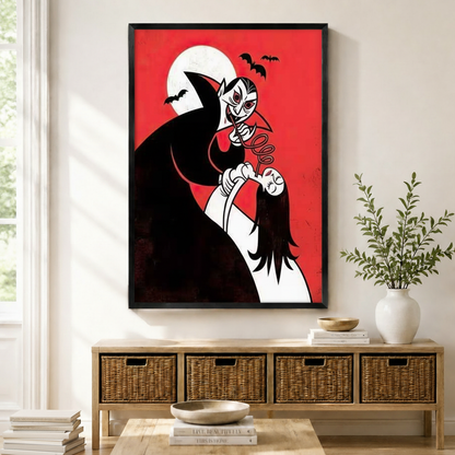 Framed retro cartoon vampire holding a woman under full moon with bats on red background wall art displayed above a wicker console in a bright modern living room

