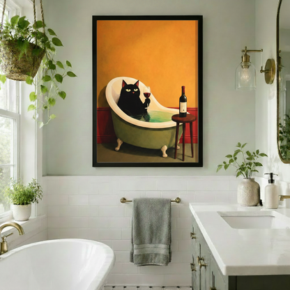 Black framed retro black cat sipping wine in a clawfoot bathtub canvas art with a green-eyed cat, a glass of red wine, and a bottle on a wooden stool against a warm orange wall with red wainscoting, displayed in a bright white bathroom with hanging pothos plant, brass wall sconce, freestanding tub, and towel bar