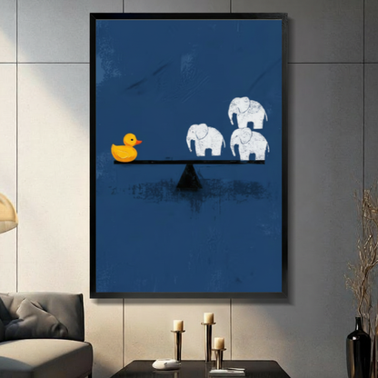 Framed minimalist rubber duck outweighing three elephants on a seesaw canvas wall art on navy blue background displayed on a dark grey wall in a modern living room with candle holders