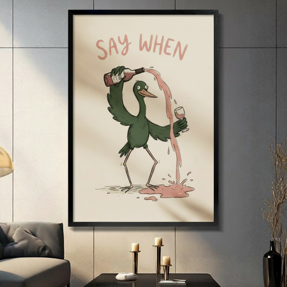 Framed say when funny bird pouring wine canvas print displayed in moody living room with candles