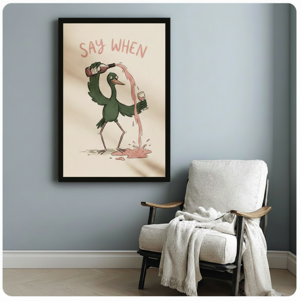 Framed say when humorous bird wine poster print on blue wall beside cozy linen armchair