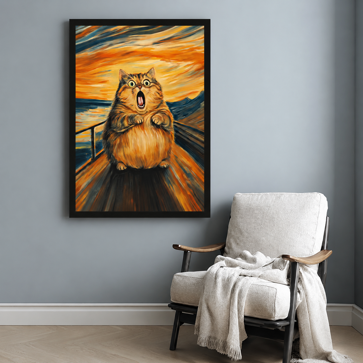 Framed screaming cat print hanging above a white accent chair in a cozy reading nook with light gray walls