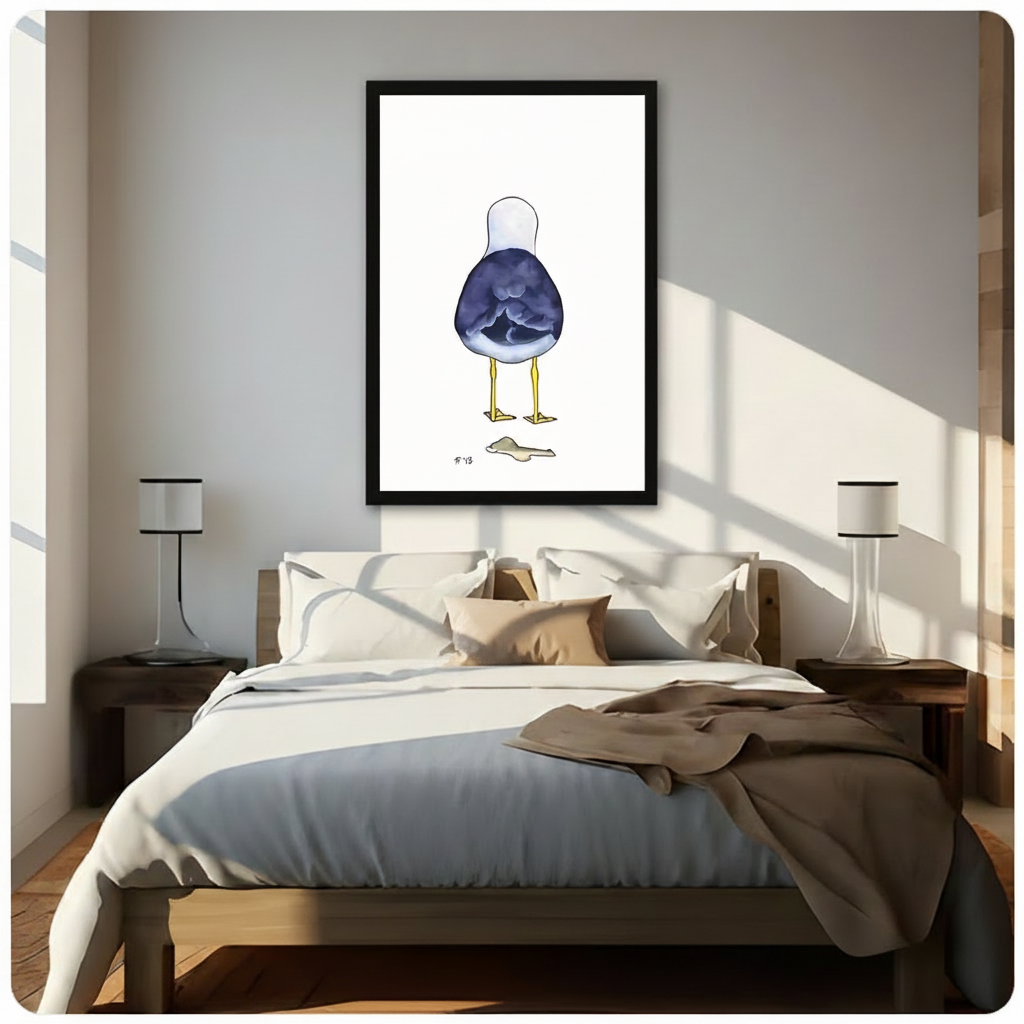 Black framed whimsical seagull back view coastal watercolor canvas wall art hung above a dark wood bed with white and beige linen bedding in a sunlit minimalist bedroom with warm diagonal light and white table lamps