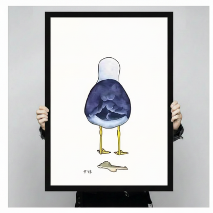 Hands in black sleeves holding a large black framed funny seagull back view watercolor canvas art print with navy blue bird and yellow legs on white background, front-facing vertical product size display