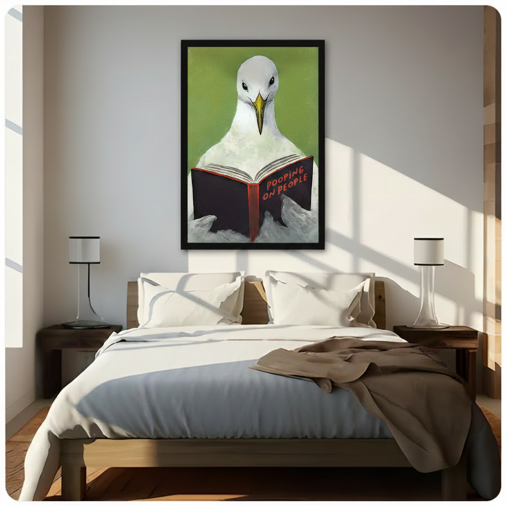 Black framed witty seagull reading Pooping on People book coastal humor canvas wall art with bright green background hung above a dark wood bed with white and beige linen bedding in a sunlit minimalist bedroom